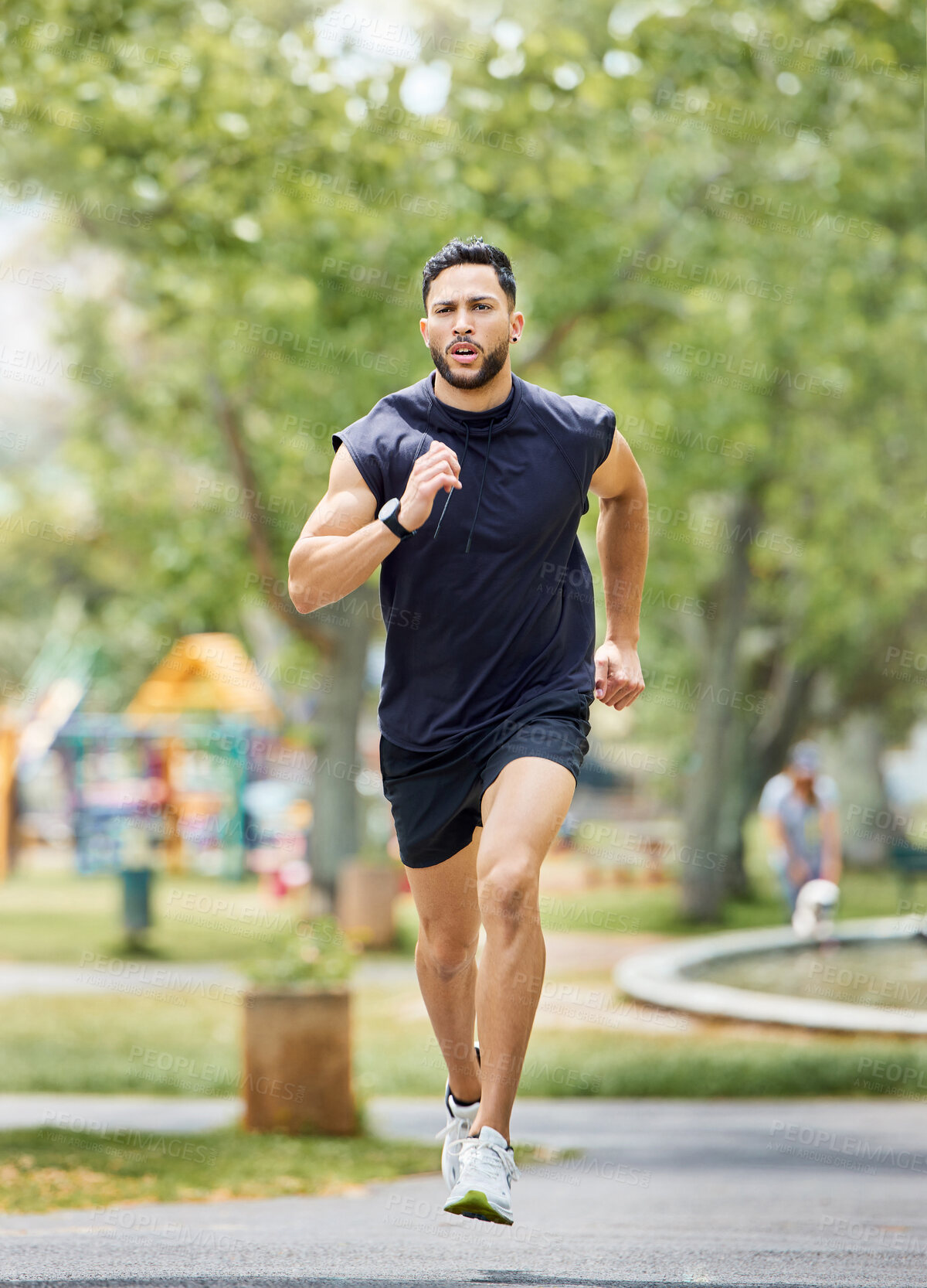 Buy stock photo Shot of a sporty young man running outdoors