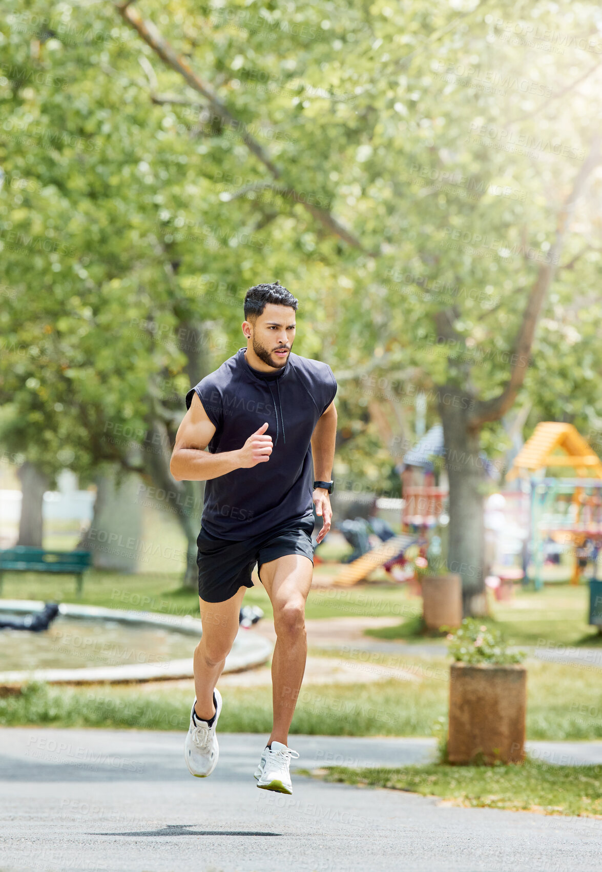 Buy stock photo Shot of a sporty young man running outdoors