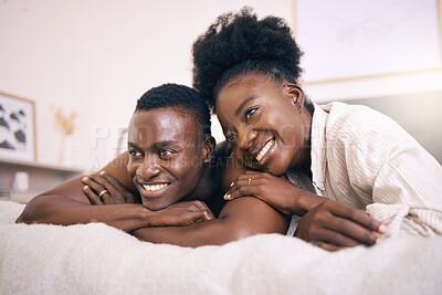 Buy stock photo Shot of a young couple relaxing together at home