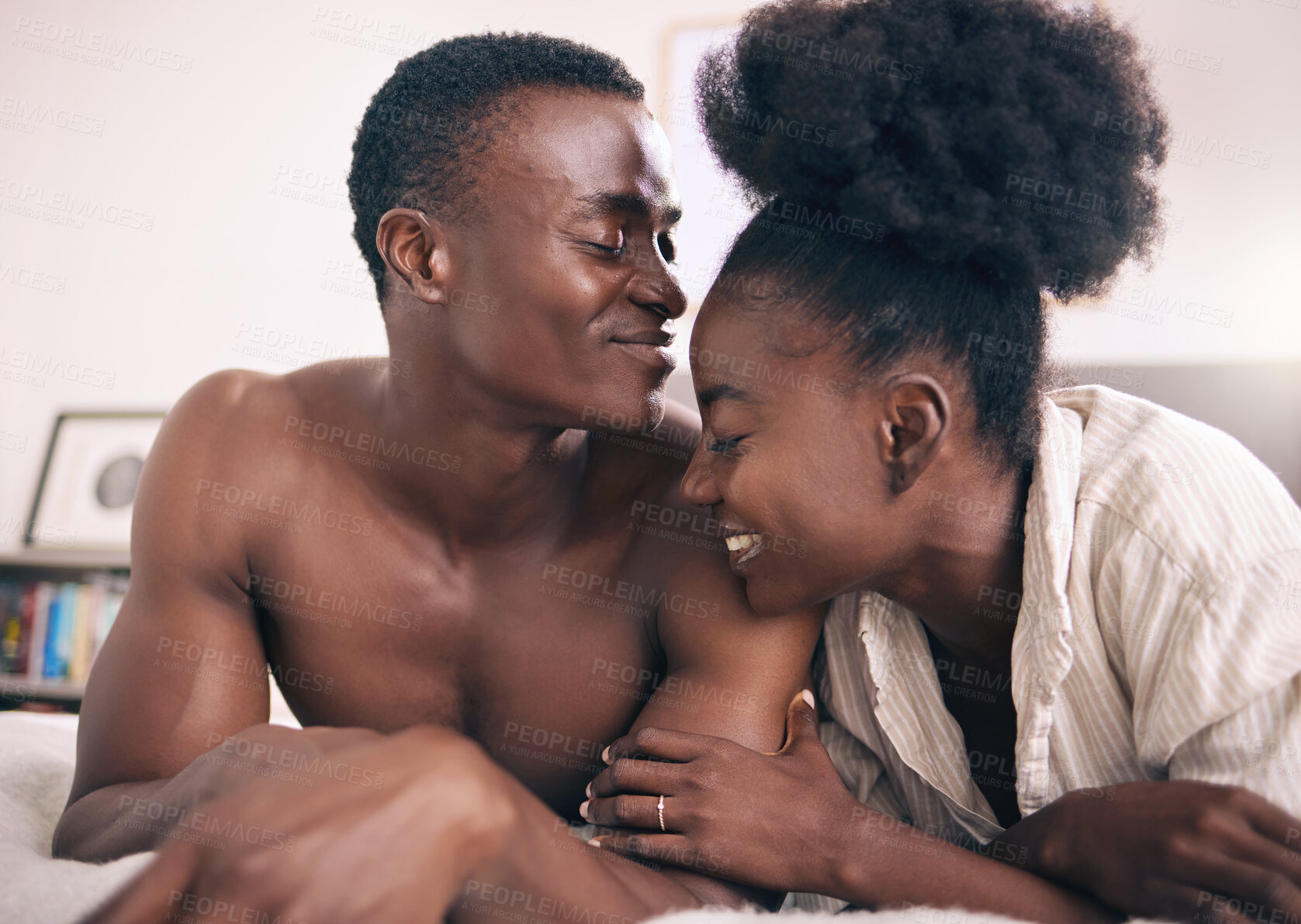 Buy stock photo Happy, relax and couple with love in bedroom for bonding, connection and morning in home. Affection, care and black people with smile for holiday, weekend or comfort in relationship at apartment