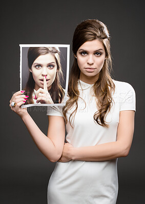 Buy stock photo Secret, portrait and woman with picture for silence, gossip and whisper on black studio background. Shush, hand and finger on lips for confidential information, privacy and holding photo of herself