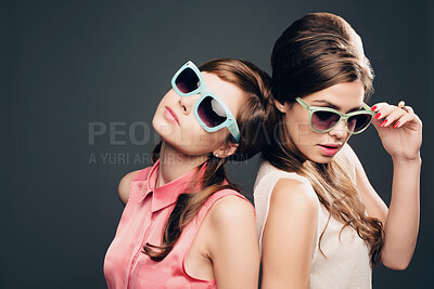 Buy stock photo Women, friends and fashion with sunglasses on dark background, pastel clothes and vintage aesthetic. People, confident and elegant wardrobe for retro beauty, bonding or beehive hairstyle of tradition