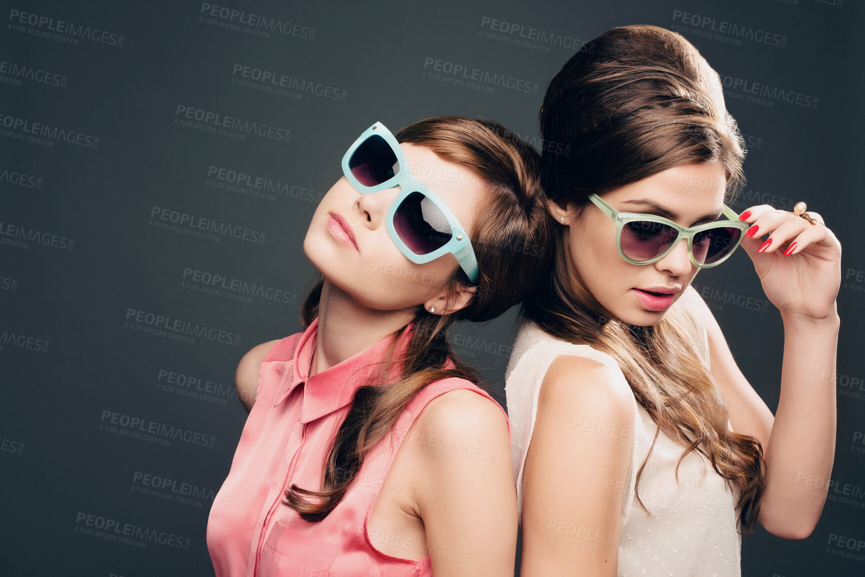 Buy stock photo Women, friends and fashion with sunglasses on dark background, pastel clothes and vintage aesthetic. People, confident and elegant wardrobe for retro beauty, bonding or beehive hairstyle of tradition