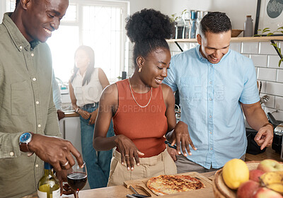 Buy stock photo Shot of a group of friends having a party together at home