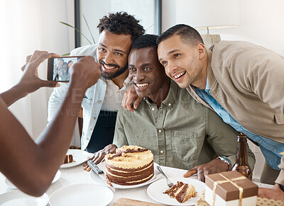 Buy stock photo Shot of a group of friends taking pictures together at a birthday celebration