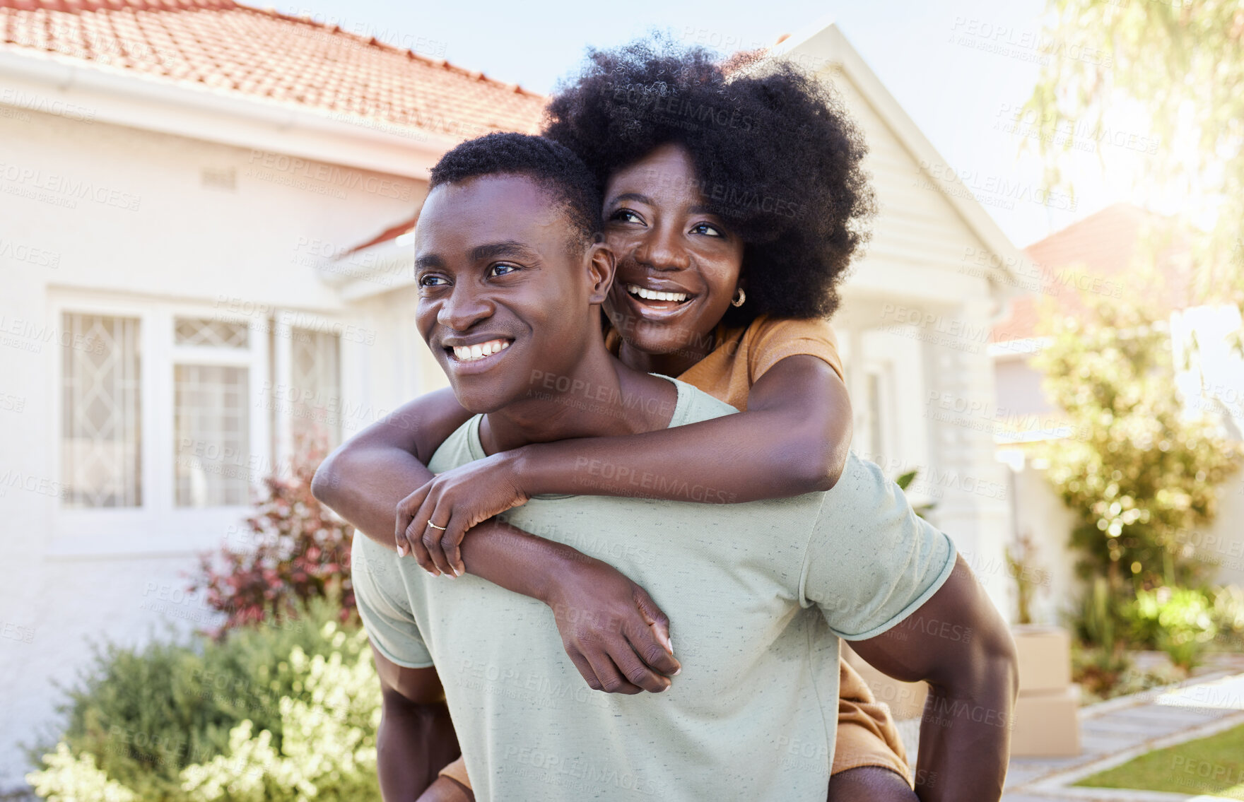 Buy stock photo Shot of a young couple moving into their new house