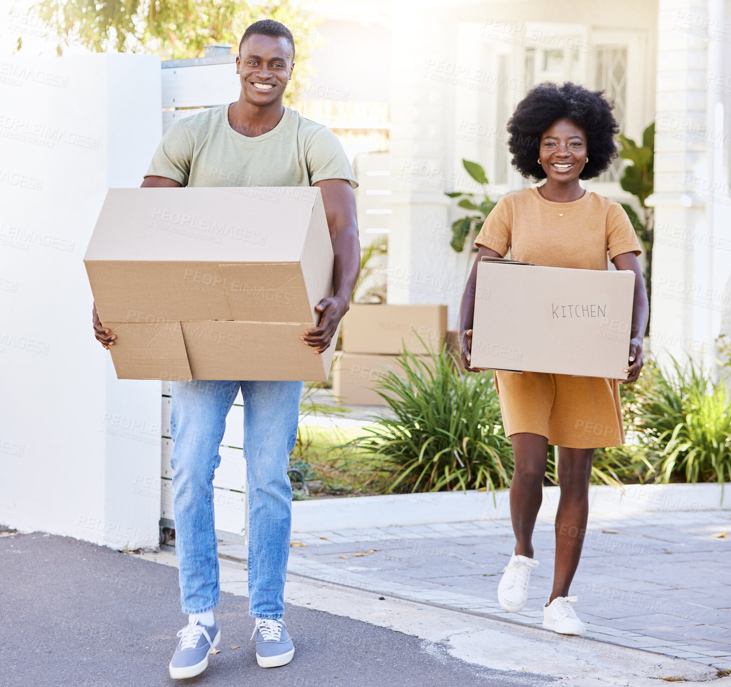 Buy stock photo Shot of a young couple moving into their new house