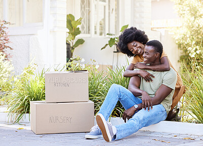 Buy stock photo Shot of a young couple moving into their new house