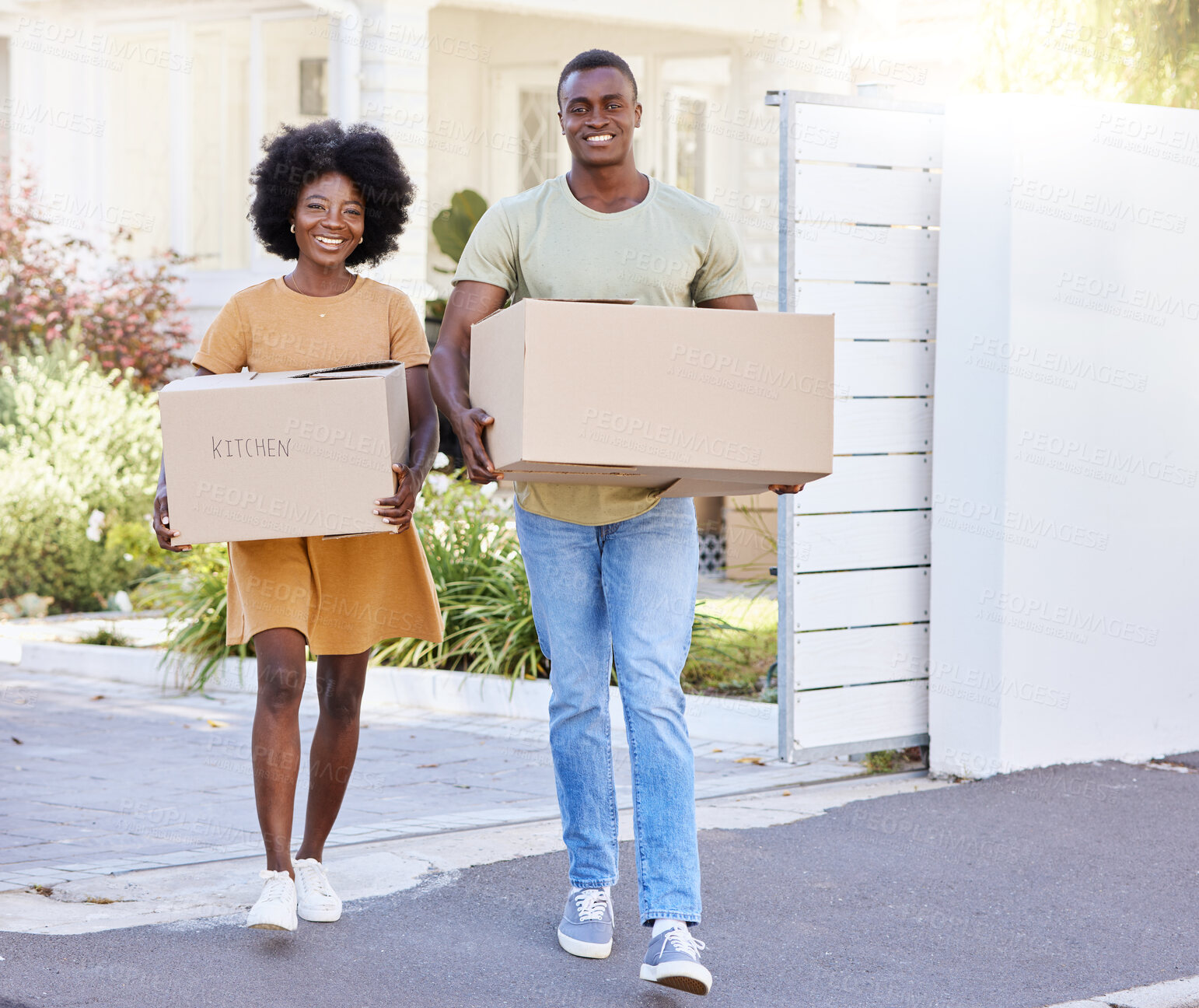 Buy stock photo Shot of a young couple moving into their new house