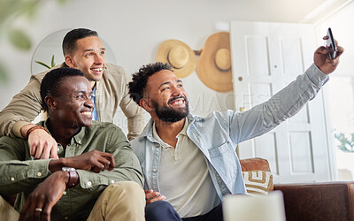 Buy stock photo Shot of a man taking a selfie with his two friends at home