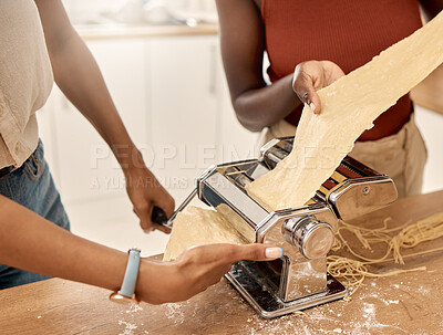 Buy stock photo Shot of two unrecognizable people cooking together at home