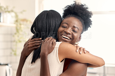 Buy stock photo Shot of two young friends spending time together at home