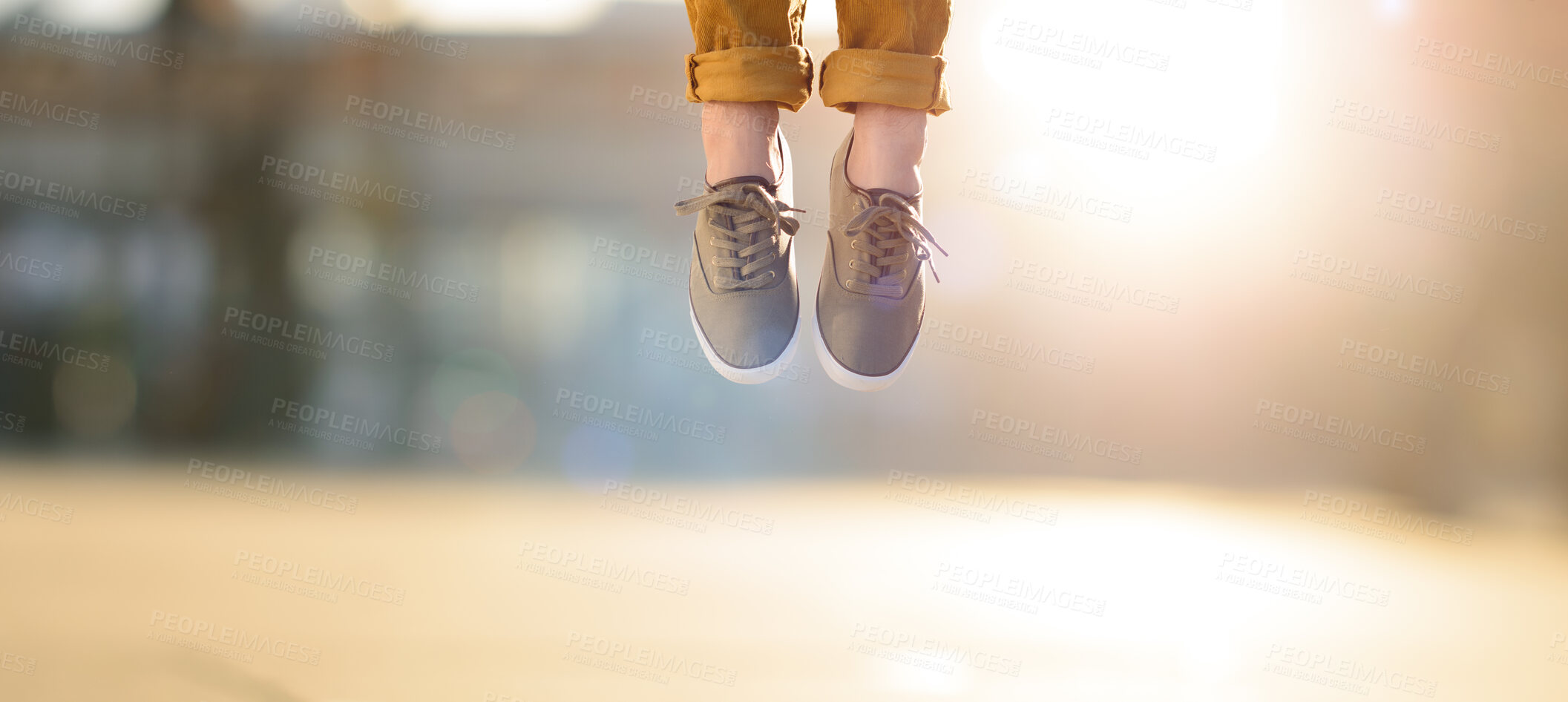 Buy stock photo Shot of a man jumping in joy mid air