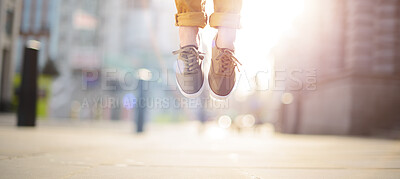 Buy stock photo Person, feet and shoes with jump in city for freedom, excitement or super natural feeling on sidewalk. Closeup, banner and legs lifting, floating or flying in air with sunshine in an urban town