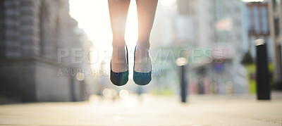 Buy stock photo Feet, woman and jumping in air outdoor for celebration, success and achievement with lens flare. Business person, foot and legs in closeup in city for victory, hopping and good news as prize winner