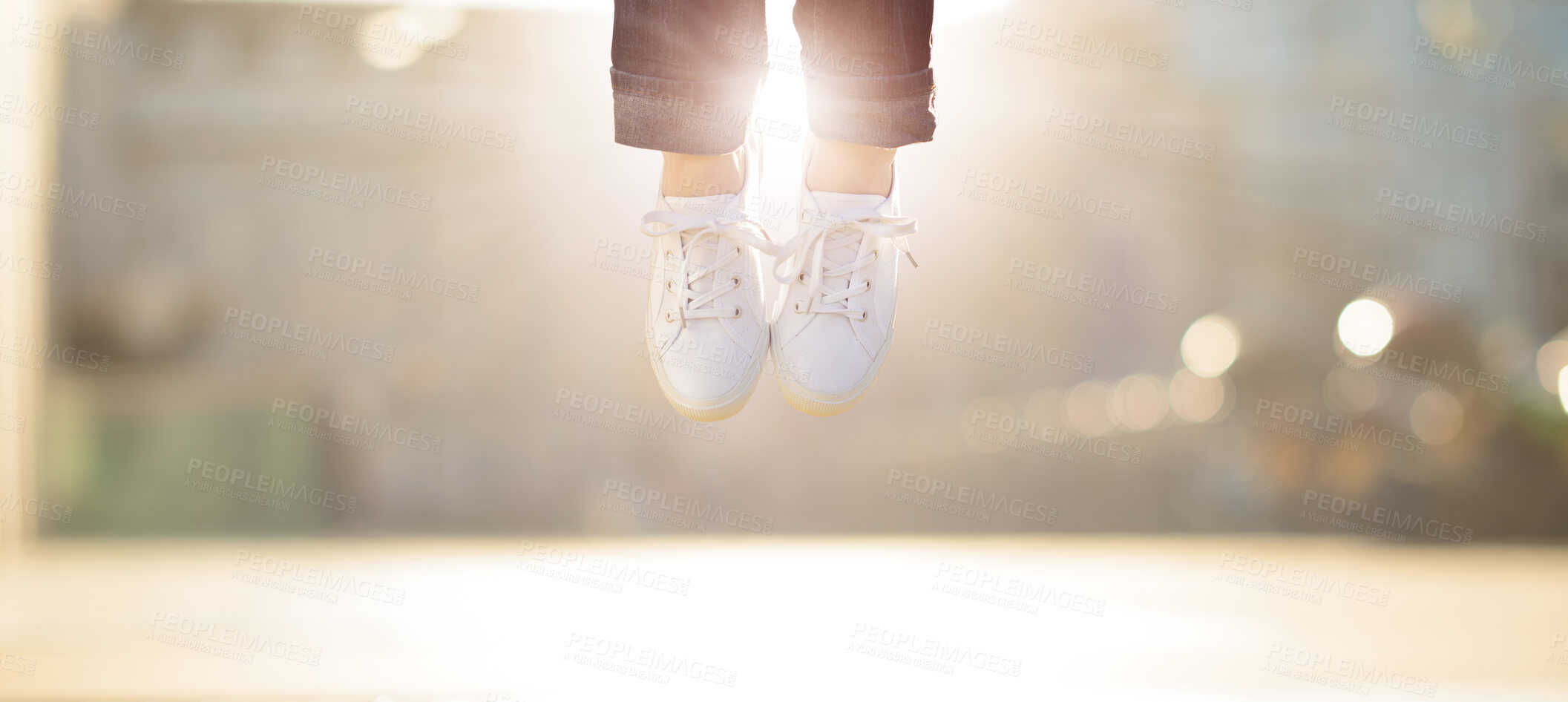 Buy stock photo Shot of a woman jumping mid air in happiness