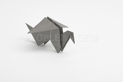 Buy stock photo Creative, studio and paper with origami bird for handmade, geometric design and art decoration. Japanese, craft and shape with animal on white background for object, sculpture and folded figure