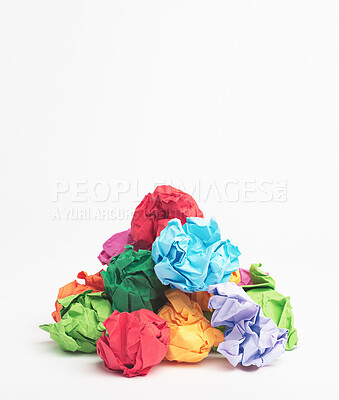 Buy stock photo Colorful, paper or trash with recycle material for dirt, disposal or pile of garbage on a white studio background. Closeup, junk and crumpled sheets or wrapping with rubbish or crumbled waste