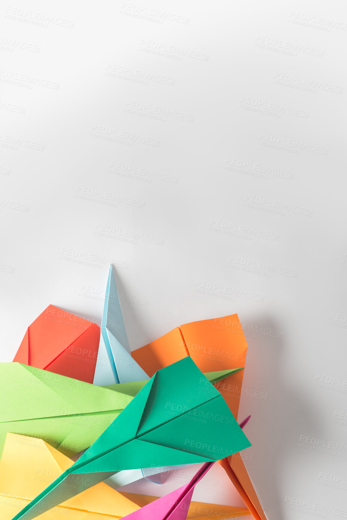 Buy stock photo Paper, creative and shape with plane in studio for colorful, craft and design of invention. Geometric, artistic and stack with jet by mockup space for handmade with origami and white background