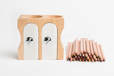 Buy stock photo Wooden, sharpener and pencils with stationary in studio for material, art or craft on a white background. Closeup, equipment or pile of wood crayons, lead or sharp objects for drawing or creativity