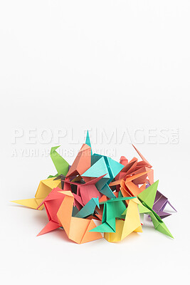 Buy stock photo Creative, studio and stack with origami bird for handmade, geometric design and art decoration. Japanese, craft and paper bunch with animal on white background for sculpture, object and folded figure