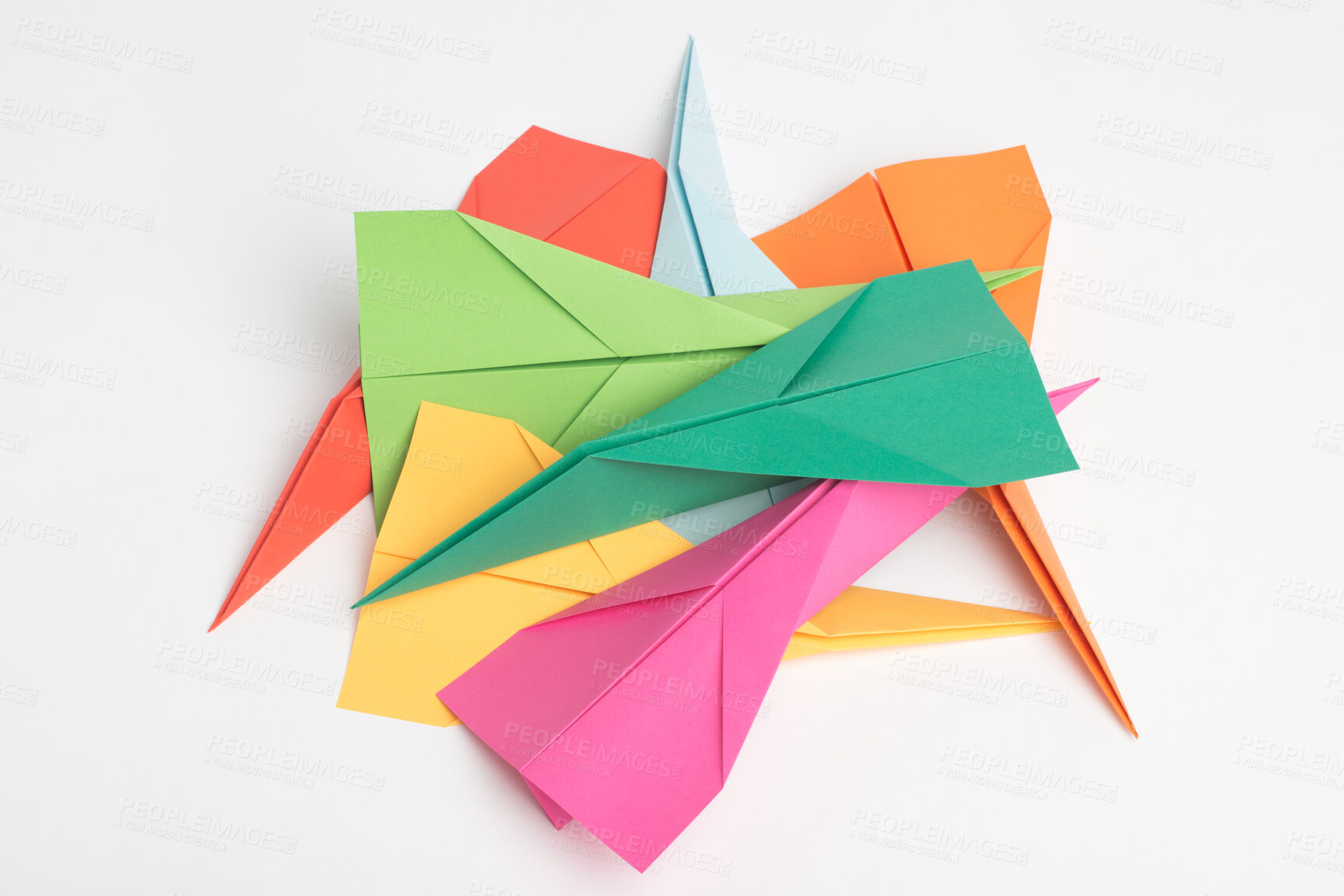 Buy stock photo Paper, creative and art with plane in studio for colorful, invention and design of handmade craft. Geometric, shape and pile with jet by white background for origami stack, aerodynamic and flight