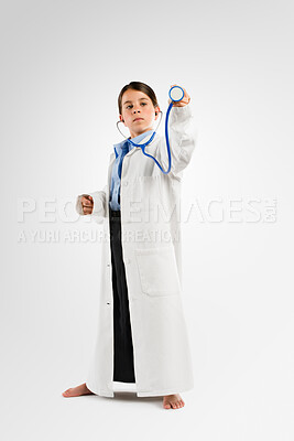 Buy stock photo Studio, stethoscope and child in doctor costume for dress up, growth or development in future healthcare career. Childhood, pretend or girl in medical clothes for professional job on white background