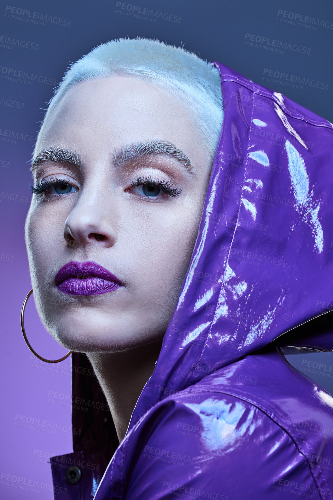 Buy stock photo Studio shot of a beautiful woman woman wearing a purple jacket and purple lipstick