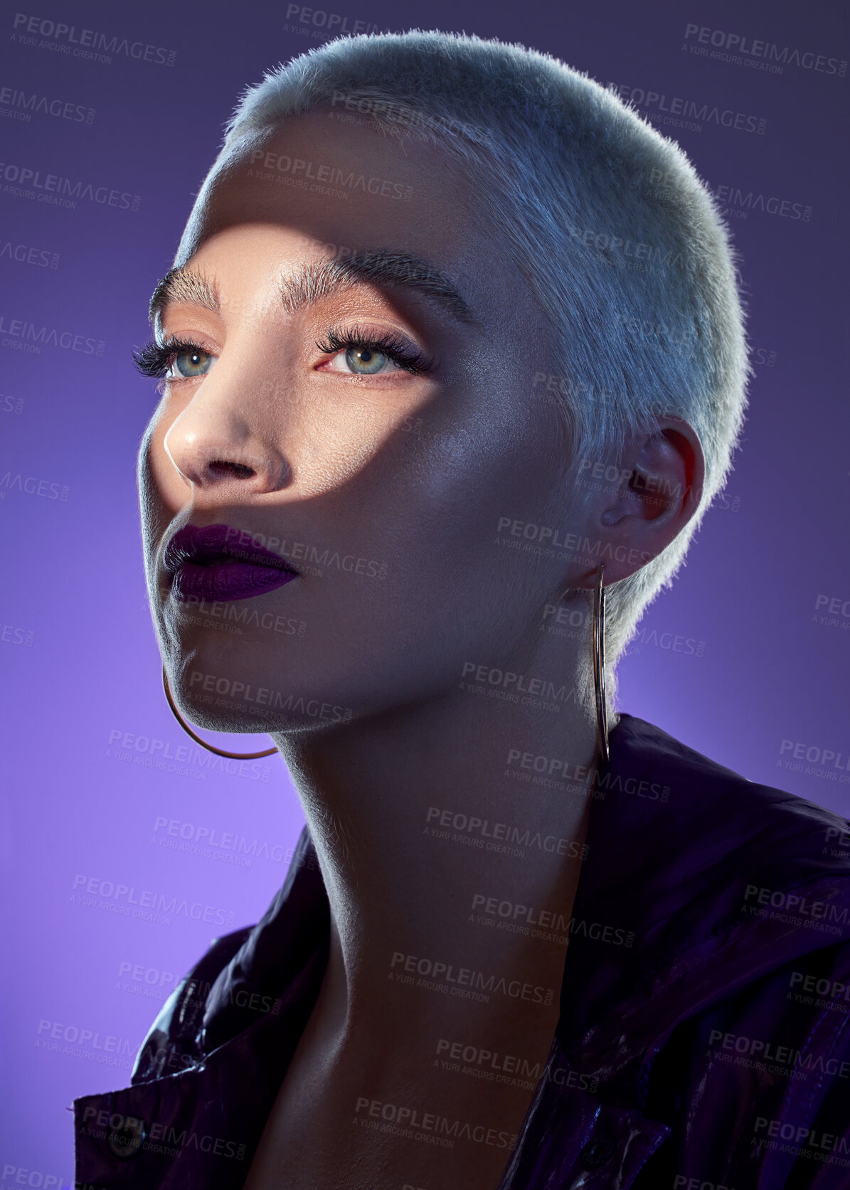 Buy stock photo Makeup, glow and woman in studio with cosmetics, shadow and beauty on purple background. Colorful, thinking and person with bold aesthetic, spotlight and edgy style for unique, artistic or creative