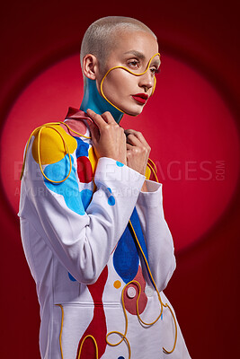 Buy stock photo Studio shot of a stylish young woman posing against a red background