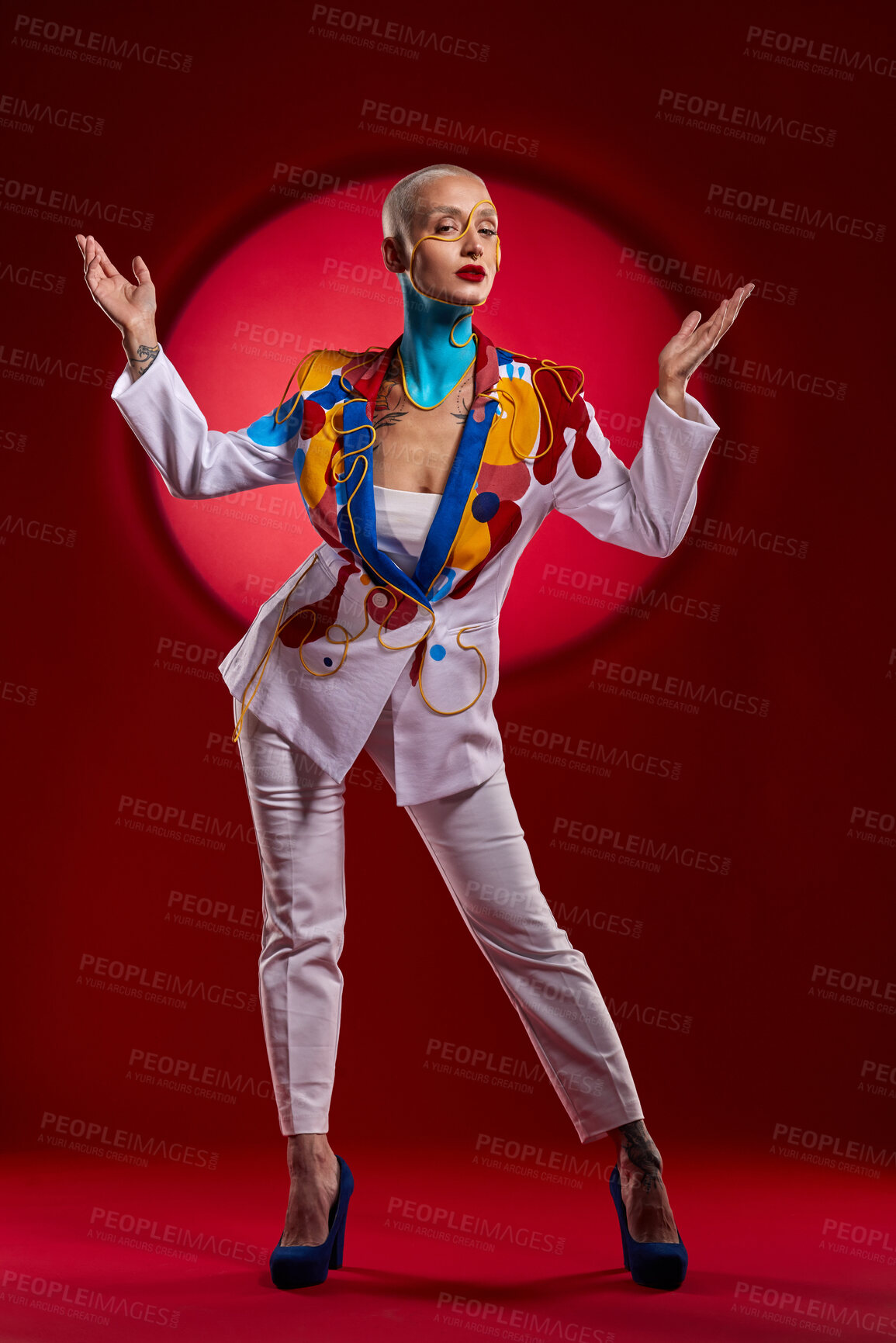 Buy stock photo Studio shot of a stylish young woman posing against a red background