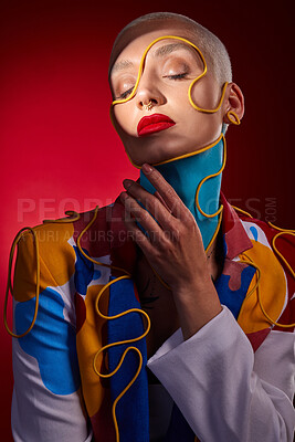 Buy stock photo Studio shot of a stylish young woman posing against a red background