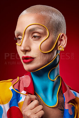 Buy stock photo Studio shot of a stylish young woman posing against a red background