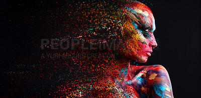 Buy stock photo Shot of a disintegration effect on a young woman posing in the studio with paint on her face and body