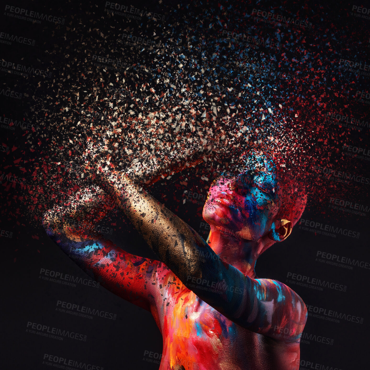 Buy stock photo Shot of a disintegration effect on a young woman posing in the studio with paint on her face and body