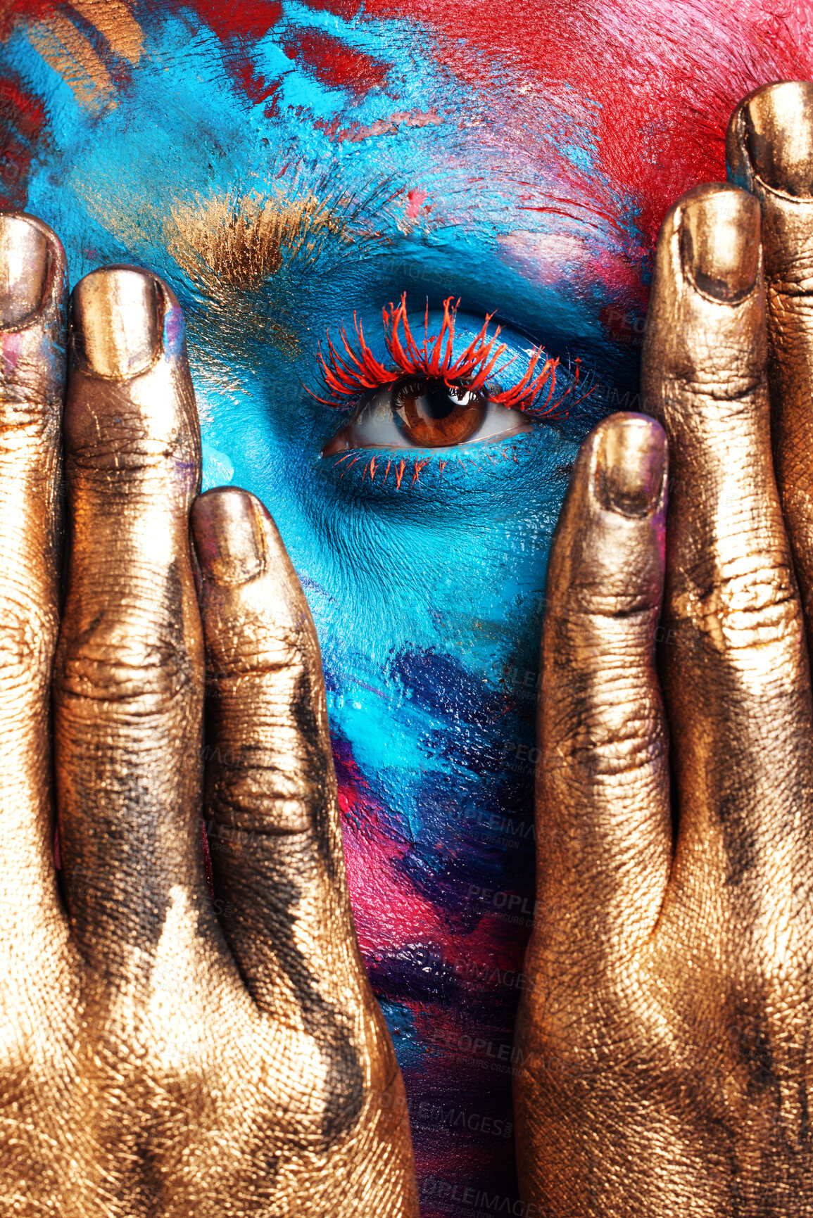 Buy stock photo Cropped shot of an unrecognisable woman posing alone in the studio with paint on her face