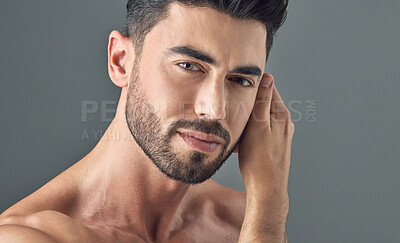 Buy stock photo Man, face and skincare on gray studio background in healthcare wellness, Brazilian beard or collagen dermatology. Portrait, model headshot and facial hair growth on grey backdrop or grooming routine