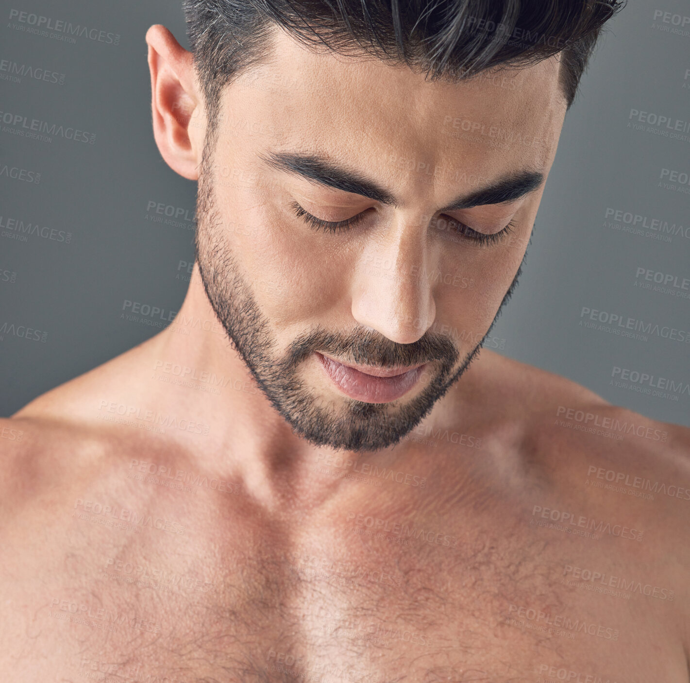 Buy stock photo Skincare, thinking and man in studio with reflection, natural beauty and glow with self care. Male person, dermatology and cosmetics with serious, shine or skin wellness for health on gray background