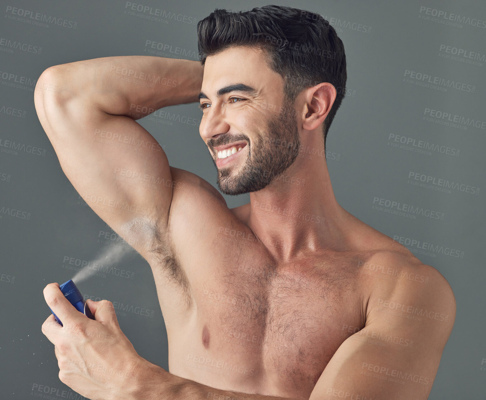 Buy stock photo Shot of a man applying deodorant to his underarms