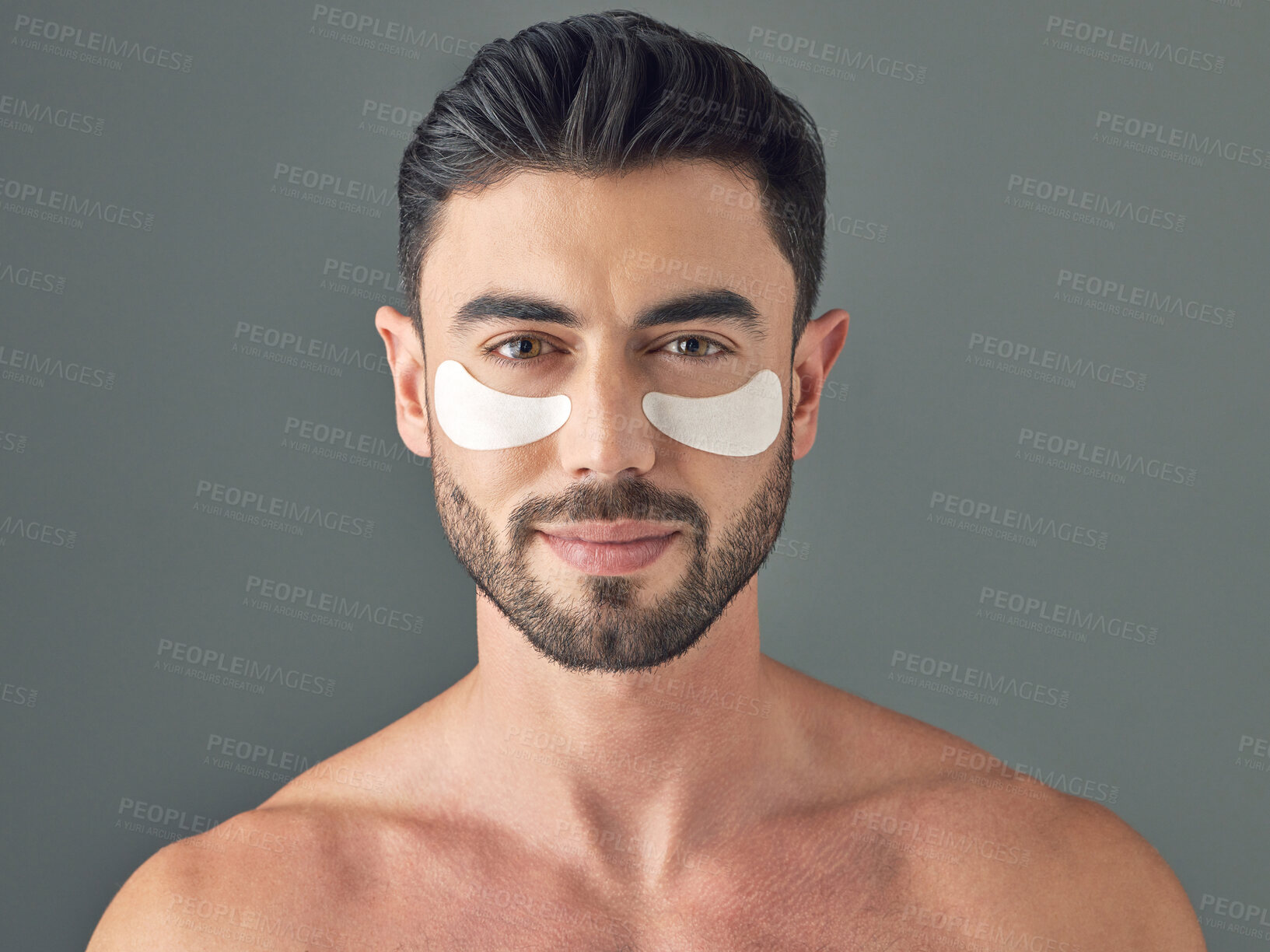 Buy stock photo Studio shot of a handsome young man wearing under-eye patches