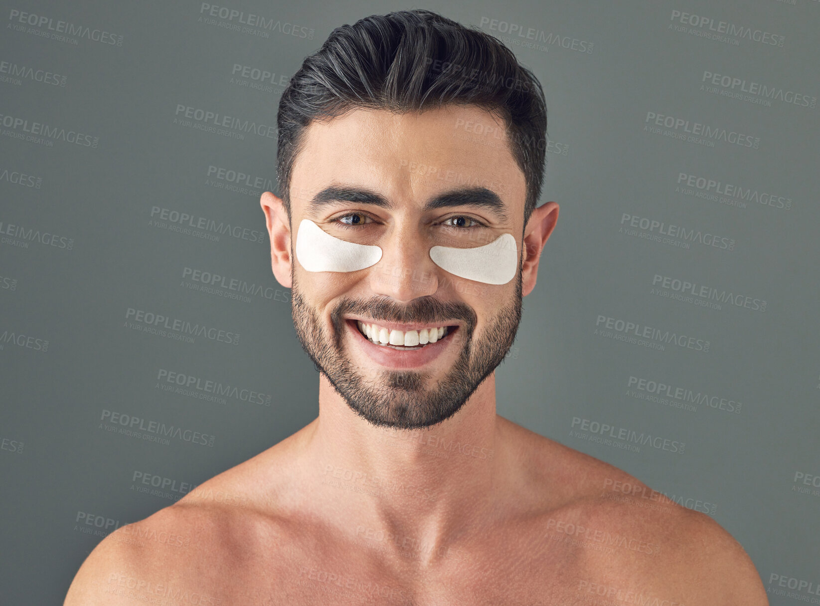 Buy stock photo Studio shot of a handsome young man wearing under-eye patches