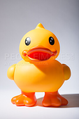 Buy stock photo Rubber, duck and toy in studio for kids, playing and children entertainment with fun squeaky sound. Plastic bird, object and white background for bath, pool and water with childhood games or activity