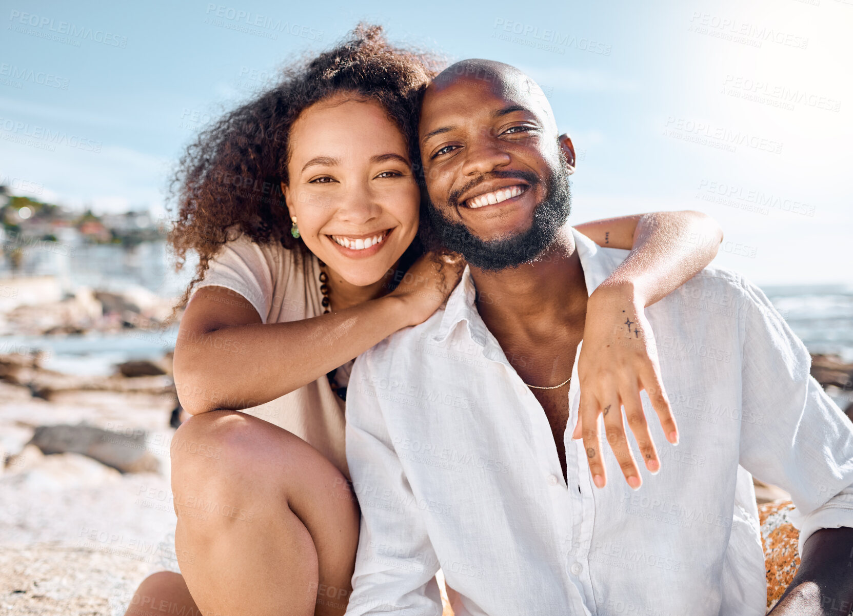 Buy stock photo Shot of a young couple spending time together at the beach