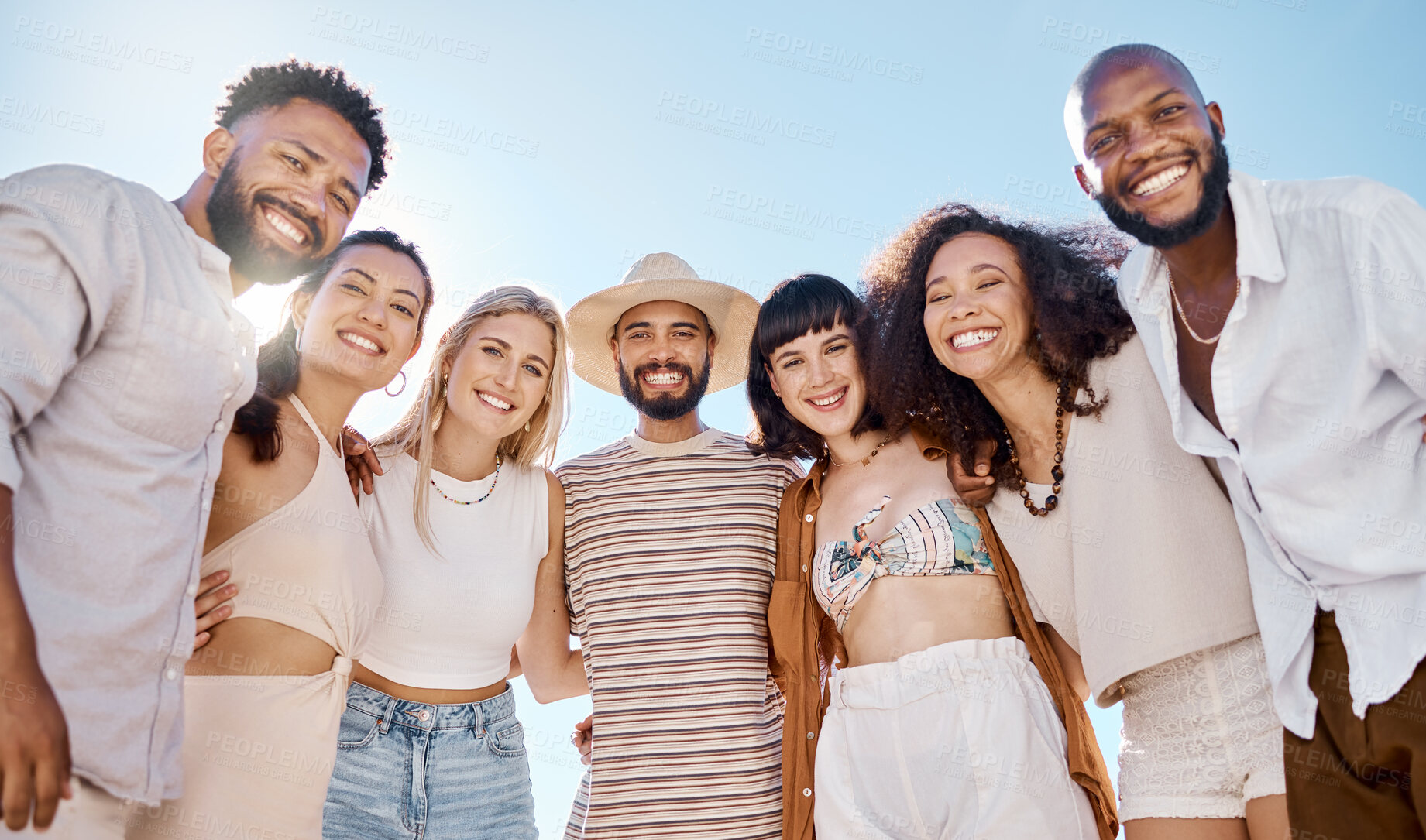 Buy stock photo Portrait, friends and people in huddle at beach for social get together, reunion or bonding for travel. Men, women and happiness on shore with diversity, community and circle for hangout at the coast