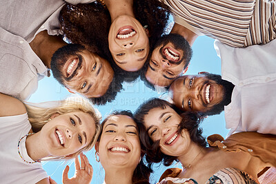 Buy stock photo Shot of a group of friends standing together in a huddle