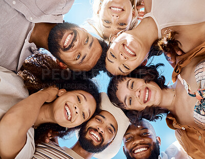 Buy stock photo Shot of a group of friends standing together in a huddle