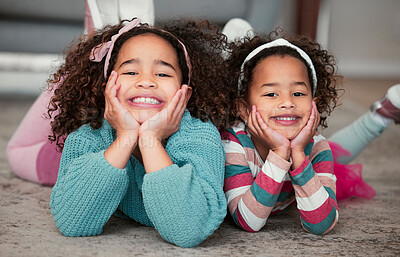 Buy stock photo Portrait of two adorable little girls sitting on the floor together at home