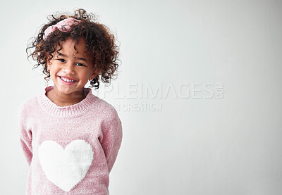 Buy stock photo Portrait, girl and kid with smile, fashion and happiness on gray studio background. Face, childhood and model with symbol, clothes and stylish outfit with joy, confidence and mockup space