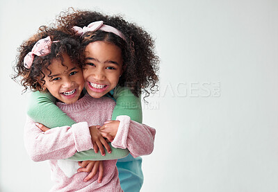 Buy stock photo Happy, hugging and portrait of children in studio with mockup space for sisters, family and love. Care, trust and girl kids embracing for bonding, connection and sweet moment by white background.