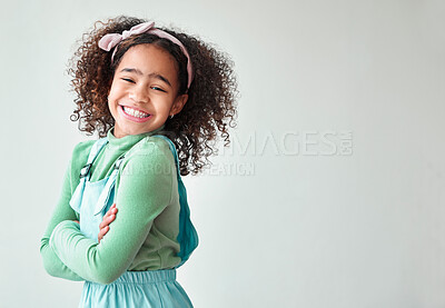 Buy stock photo Portrait, kid and girl with arms crossed, excited and happiness on white studio background. Face, model and child with confidence, pride and mockup space with fun, positive person and emotion